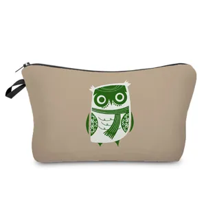 Detailed view of the cute owl print cosmetic bag, highlighting the neat zipper and fabric texture.