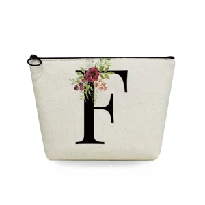 Linen cosmetic bag with black letter F and floral print, stylish makeup pouch for daily use.