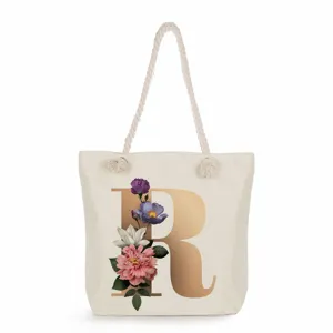 Canvas tote bag with gold letter R and floral print, stylish and large capacity shoulder bag.