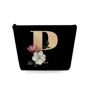 Zwarte cosmetische tas met gouden letter P en bloemenprint, handig make-up etui.