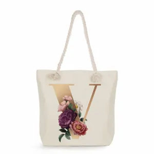 Canvas tote bag with elegant gold letter V and floral print, casual large capacity shoulder bag.