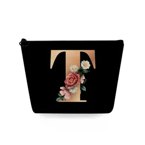 Zwarte cosmetische tas met gouden T-letter en bloemenprint, handig make-up tasje.