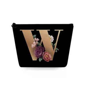 Zwarte cosmetische tas met gouden letter W en bloemenprint, draagbaar make-up etui voor dames.