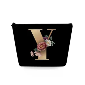 Zwarte cosmetische tas met gouden letter Y en bloemenprint, handig voor dagelijks.