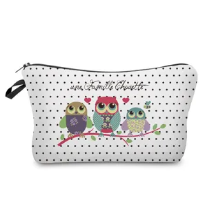 Cute owl family print cosmetic bag detail, white polka dot pattern makeup pouch with zipper.