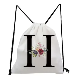 White canvas drawstring backpack featuring a stylish black letter H and floral print detail.