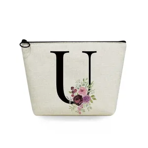 Canvas cosmetic bag detail featuring elegant large letter U print with beautiful watercolor floral design.