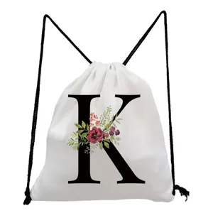 White monogram letter K drawstring backpack with watercolor floral print for daily casual use.