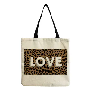 Reusable canvas tote shoulder bag with chic leopard print and LOVE letter graphic design.