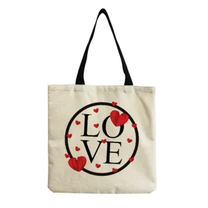 Canvas tote bag with love heart print and black handles for casual daily shopping use.