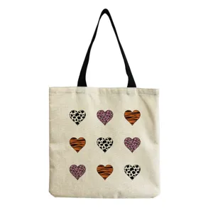 Canvas tote bag featuring cute animal print heart patterns, versatile casual shoulder bag.