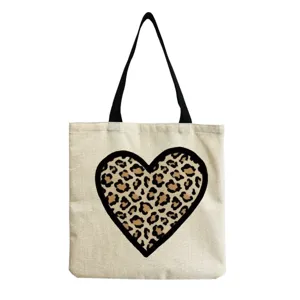 Canvas tote bag with stylish leopard print heart design, casual shoulder bag for women daily use.
