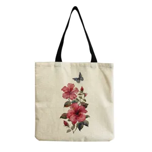 Close-up view of the canvas tote bag featuring a delicate watercolor floral and butterfly print.