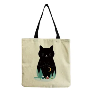 Close-up detail of the canvas tote bag featuring a cute black cat night landscape print.