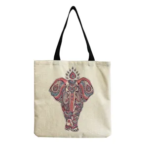 Detailed view of the canvas tote bag showing the intricate mandala elephant print and straps.