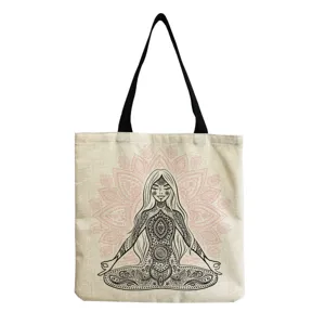 Close-up detail of the canvas tote bag featuring a yoga girl mandala art print pattern.