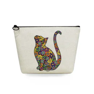 Canvas cosmetic bag detail showcasing vibrant floral cat print and smooth black zipper closure.