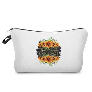 Detailansicht der Kosmetiktasche mit Sonnenblumen-Druck und praktischem Tragegriff.