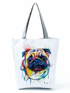 Close-up detail of the colorful watercolor pug printed canvas tote bag for casual daily use.