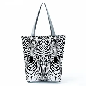 Detailed view of the black and white symmetrical zebra pattern canvas tote bag, spacious design.