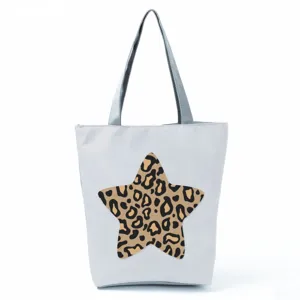 Casual grey canvas tote bag with large leopard star print, spacious everyday shoulder handbag.