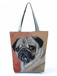 Close-up detail view of the artistic pug oil painting print on the stylish canvas tote bag.