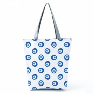 Large capacity canvas tote bag featuring classic blue evil eye pattern print with grey handles.