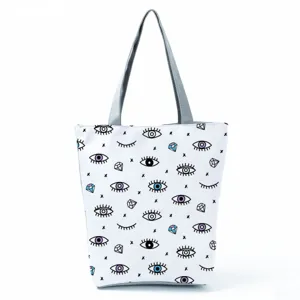 Close-up detail of the funny eye pattern print canvas tote bag fabric and texture view.
