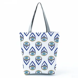 Evil eye pattern canvas tote bag, casual large capacity shoulder bag for daily use.