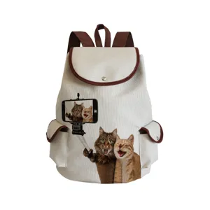 Close-up view of the cute cat selfie print detail on the stylish canvas backpack surface.