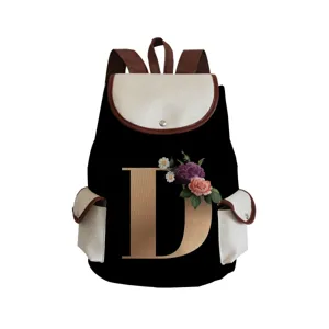 Stylish canvas backpack with custom golden letter D and floral print for daily use and travel.