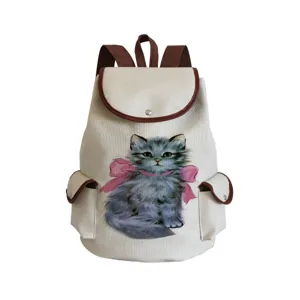 Cat print canvas backpack front detail, cute grey kitten with pink bow design, close-up.