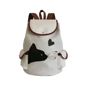 Canvas backpack detail view, featuring cute black cat pattern and stylish brown trim design.