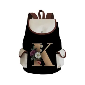Canvas letter K print backpack detail view, stylish black and beige casual school book bag.