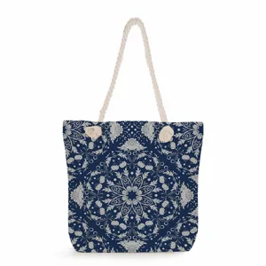 Blue and white floral canvas tote bag detail, durable fabric with strong rope handle.