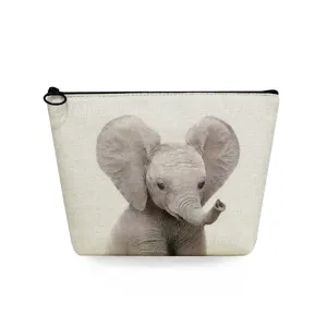 Cute baby elephant print makeup bag detail, featuring linen texture and smooth zipper.