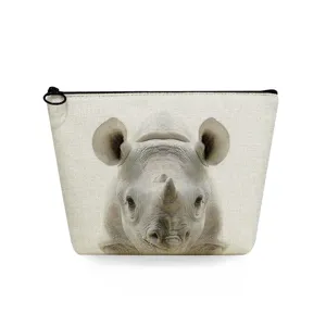 Compact canvas toiletry bag with realistic rhino print detail, zipper closure design.