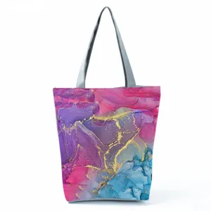 Detailed view of the abstract colorful print tote bag, featuring fluid art design.
