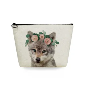 Close up detail view of the travel cosmetic bag featuring a cute wolf with floral crown print.