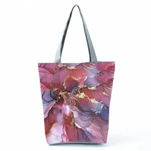 Detailed view of abstract pink purple tote bag pattern with elegant gold vein accents.