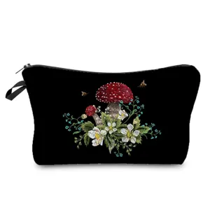 Detailed view of the black cosmetic bag featuring exquisite mushroom and floral embroidery.