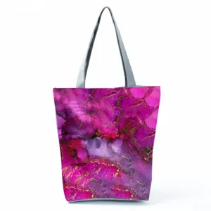 Detailed view showing the pink and purple abstract marble pattern of the casual tote bag.
