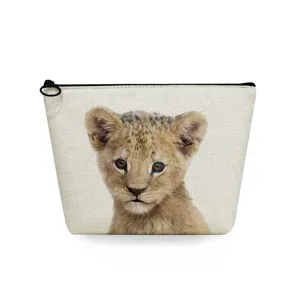 Detail view of the portable canvas makeup bag featuring a cute baby lion cub print design.