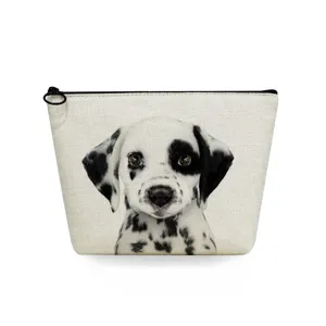 Close-up detail of the canvas cosmetic pouch featuring a cute dalmatian puppy print zipper.
