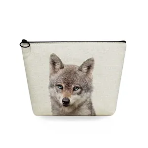 Detail shot of canvas toiletry makeup pouch featuring a realistic wolf print design.
