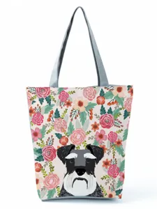 Vue détaillée du sac cabas en toile avec imprimé floral et chien schnauzer idéal.