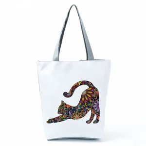 Sac à bandoulière en toile avec motif de chat floral, fourre-tout décontracté pour voyage.