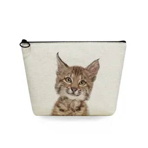 Close-up of the canvas cosmetic pouch featuring a cute printed lynx pattern and black zipper.