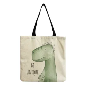 Detalle de impresión de dinosaurio verde de dibujos animados en bolso de lona informal.