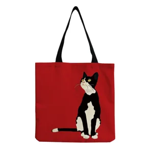 Red canvas tote bag featuring a cute black white cat print, sturdy handles, daily shopping bag.
